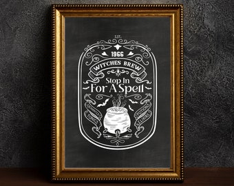 May include: A framed chalkboard-style print with a gold-colored frame. The print features white text and illustrations, including a cauldron, bats, and the words "Witches Brew Stop In For A Spell." The year "1966" is also displayed.