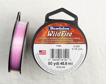 May include: A spool of pink Beadalon WildFire thermally bonded bead weaving thread. The label states it is 0.006 inches (0.15 mm) thick and contains 50 yards (45.8 meters) of thread.  The label also states that it is intended for adult use only.
