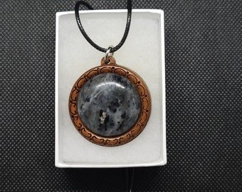 Larvakite gemstone pendant.