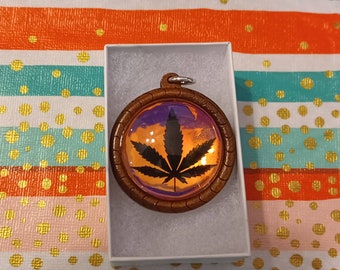 Pot leaf glass pendant with wood backing