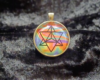 Merkaba/flower of life double sided glass pendant.