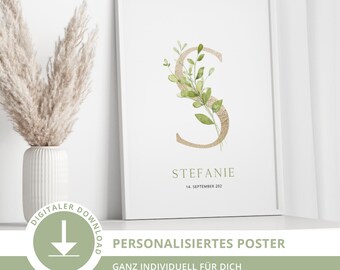 May include: A framed print featuring the name "Stefanie" and the date "14. September 202". The artwork displays a gold letter "S" adorned with green leaves. The print also includes the text "PERSONALISIERTES POSTER" and "DIGITALER DOWNLOAD".