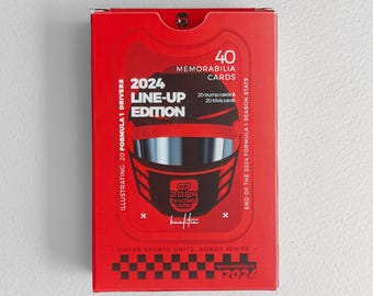 May include: A rectangular red box for 2024 Line-Up Edition memorabilia cards. The front features a black racing helmet graphic, white text reading 2024 Line-Up Edition, 40 memorabilia cards, 20 trump cards, 20 trivia cards, and a checkered pattern.