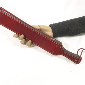 The Small Straddle a cross between a Leather Strap and a leather Paddle