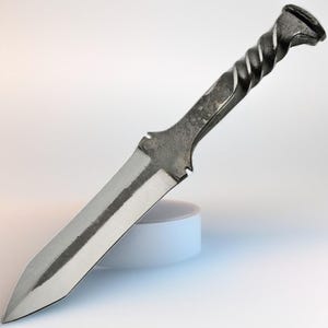 May include: A handcrafted metal knife with a polished blade and a twisted handle. The blade is silver, and the handle is a darker, textured metal. The knife has a pointed tip and a sturdy, functional design.