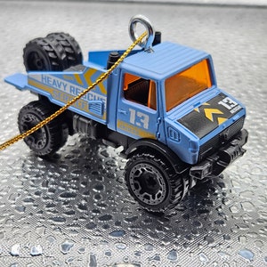 Hot Wheels Mercedes Benz Unimog 1300L Blue or Brown Christmas tree ornament