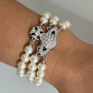 【Vivienne Westwood】Graziella Three Row ブレスレット White & Gold Graziella Three Row Pearl Bracelet by Vivienne