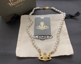New in Box Vivienne Westwood Gold Pearl 