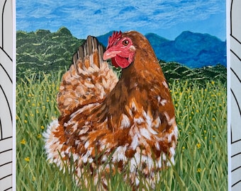 May include: A painting of a hen in a field of green grass and yellow flowers. The hen has brown and white feathers, a red comb and wattle, and is set against a backdrop of blue sky and mountains. The artwork is framed in white.
