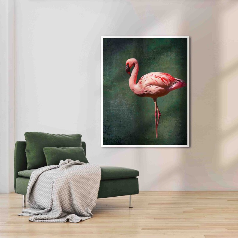 May include: A pink flamingo stands on one leg against a dark green background. The flamingo has a long neck and a long, thin beak. The background is textured and has a vintage look.