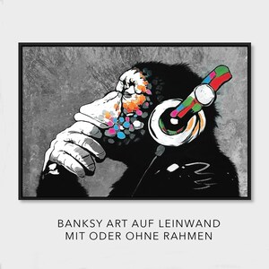 May include: A black and white illustration of a monkey wearing headphones with colorful accents. The monkey is thinking and has a thoughtful expression. The background is a gray textured surface.