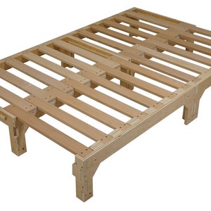 May include: A wooden slat bed frame with four legs. The frame is made of natural wood and has a simple design.