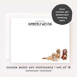 May include: White stationery featuring a custom pet watercolor drawing. The stationery includes the text "a note from KIMBERLY WESTIN" and illustrations of three dogs. The bottom of the stationery reads "custom multi pet stationery".