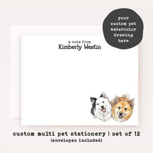 May include: White stationery with a watercolor illustration of two dogs. The stationery includes the text "a note from Kimberly Westin" and "your custom pet watercolor drawing here". The bottom of the stationery reads "custom multi pet stationery | set of 12".