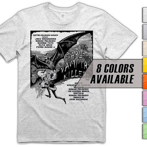 May include: A grey t-shirt featuring a black and white illustration of a bat and the text "The Fearless Vampire Killers" on the front. The text below the illustration includes the movie credits, including the names Roman Polanski and Sharon Tate. The t-shirt is available in 8 colours.