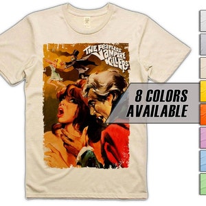 May include: A beige t-shirt featuring a vintage movie poster print of "The Fearless Vampire Killers". The poster depicts a woman with long brown hair and a man with a beard. The text "8 Colours Available" is displayed in a white box.