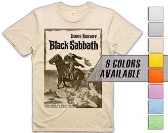 May include: A beige t-shirt with a vintage movie poster design featuring Boris Karloff and the text "Black Sabbath". The poster is in black and white and shows Karloff riding a horse. The t-shirt is available in 8 colors.