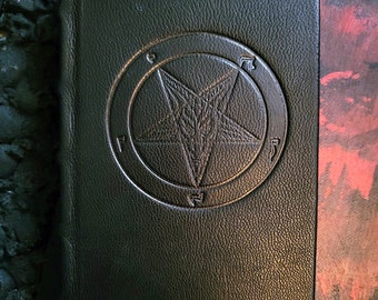 The Satanic Bible by Anton LaVey. Real goatskin leather bound hardcover.