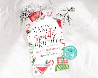 May include: White gift tag with red and green watercolor illustrations of presents, candy canes, and a martini glass. The text reads "Making Spirits Bright" and "Happy Holidays from Meredith Wilson". A blue circle with the text "Personalize with Coril" is in the corner.