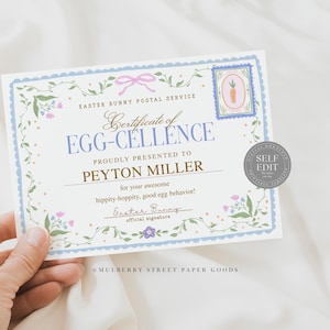 May include: A certificate with a blue and floral border, featuring the text "Certificate of Egg-Cellence" and "Easter Bunny Postal Service." The certificate is presented to Peyton Miller. A stamp with a carrot illustration is visible.
