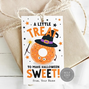 May include: A Halloween-themed gift tag with a cartoon donut wearing a witch hat and holding a magic wand. The tag reads "A Little Treat To Make Halloween Sweet!" in orange and black lettering, with star accents.