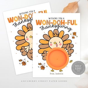May include: Thanksgiving greeting cards with a cartoon turkey illustration. The cards feature the text "Wishing You a Won-Doh-Ful Thanksgiving". The turkey is brown, orange, and yellow, holding an orange circle. The cards are on a white background.