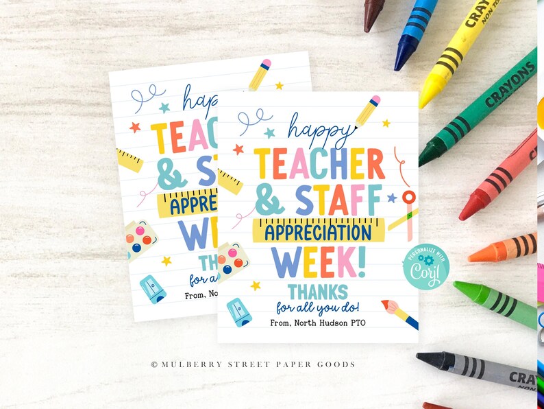 May include: Two white cards with colorful text that reads "Happy Teacher & Staff Appreciation Week!" with school-themed illustrations. Crayons of various colors are scattered around the cards.