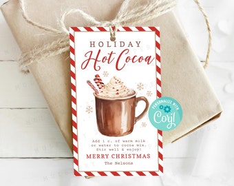 May include: Red and white striped gift tag with a watercolor illustration of a mug of hot cocoa with whipped cream and candy canes. The text on the tag reads "HOLIDAY Hot Cocoa" and "MERRY CHRISTMAS".