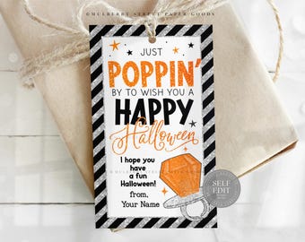 May include: A Halloween gift tag with a black and silver striped border. The tag reads "Just Poppin' by to wish you a Happy Halloween!" in orange and black text. A ring pop graphic is featured.