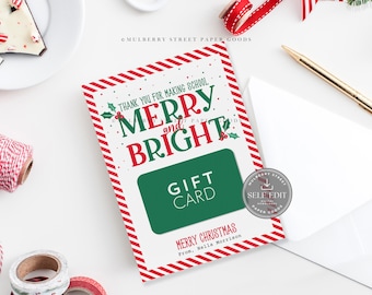 May include: A rectangular gift card holder featuring a red and white striped border, green and red text reading "THANK YOU FOR MAKING SCHOOL MERRY AND BRIGHT" and "MERRY CHRISTMAS FROM, NELLA MORRISON," with a central green rectangle labeled "GIFT CARD."