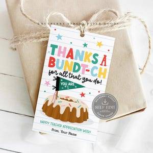 May include: A gift tag with the text "THANKS A BUNDT-CH for all that you do!" and a cartoon bundt cake illustration. The tag is tied to a wrapped gift with twine.