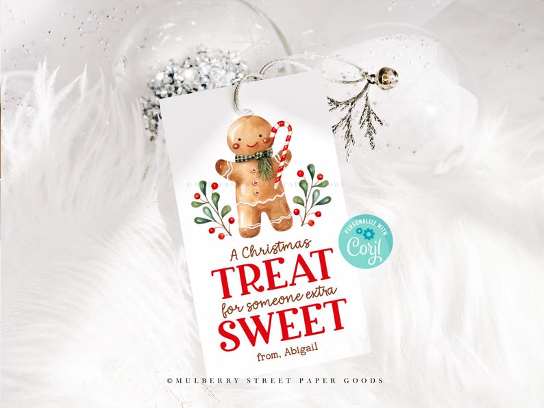 May include: A white gift tag with a gingerbread man illustration and the text "A Christmas Treat for someone extra SWEET from. Abigail". The tag is decorated with red berries and green leaves.