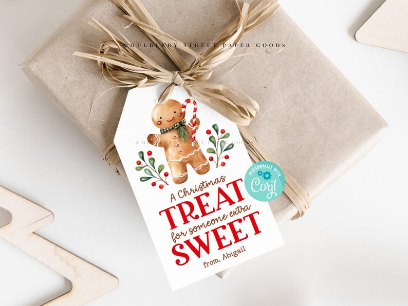 May include: A white gift tag with a gingerbread man illustration and red text that reads "A Christmas Treat for someone extra Sweet from. Abigail".