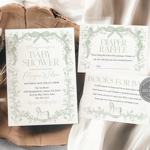 May include: Baby shower invitations and inserts with a floral and bow design in soft green. The invitation includes the text "Baby Shower" and event details. The inserts include a diaper raffle and a request for books.