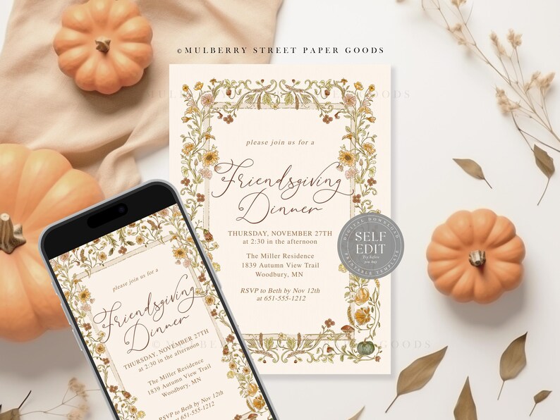 May include: An invitation for a Friendsgiving Dinner, displayed on a smartphone and a printed card, with floral border and text. The invitation is surrounded by small pumpkins and dried leaves, creating a fall theme.