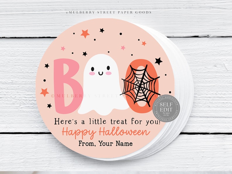 May include: Round stickers with a light pink background featuring a cartoon ghost, the word "BOO", and a spiderweb. The stickers also include the text "Here's a little treat for you! Happy Halloween From, Your Name".