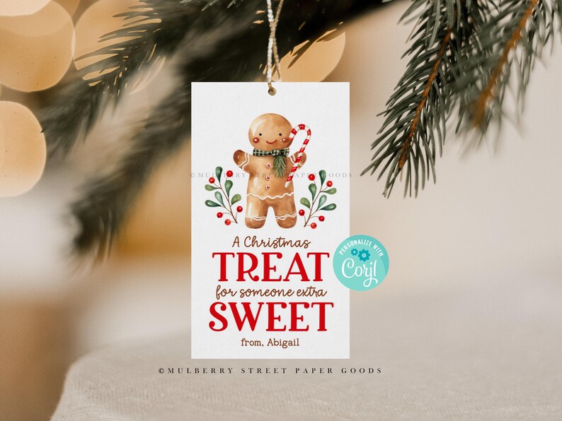 May include: A Christmas gift tag featuring a gingerbread person illustration with a red candy cane. The tag reads "A Christmas Treat for someone extra SWEET from. Abigail" and has a customizable area with the text "PERSONALIZE WITH Cory!"