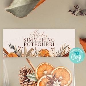 May include: A printable gift tag with a watercolor illustration of orange slices, cinnamon sticks, and greenery. The text on the tag reads "Holiday Simmering Potpourri".