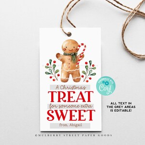 May include: A Christmas gift tag featuring a gingerbread man with a candy cane. The tag says "A Christmas Treat for someone extra Sweet" and has a space to write "from." The text "ALL TEXT IN THE GREY AREAS IS EDITABLE!" is also included.