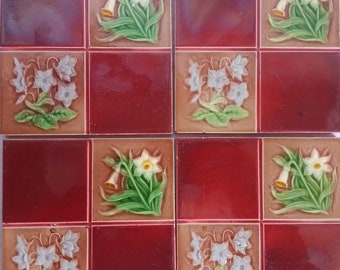 Four Edwardian ceramic tiles