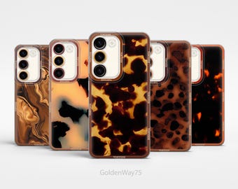 May include: Five different phone cases with a tortoise shell pattern. The cases are all clear and have a black and brown tortoise shell design. The cases are all lined up in a row from left to right.