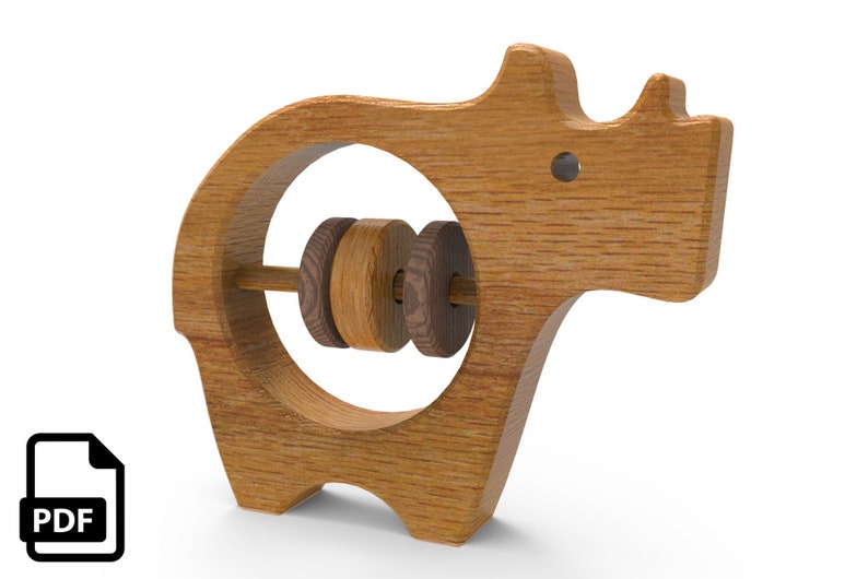 Woodworking Plans for a Wooden Baby Rattle in the shape of an Rhinoceros. These beginner friendly woodworking plans are an easy project and make a thoughtful gift for grandchildren and friends.