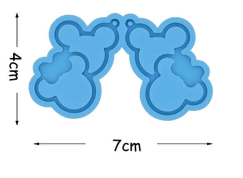 May include: A blue silicone mold for making resin earrings. The mold is shaped like two pairs of cartoon ears, each with a hole at the top for hanging. The mold measures 7 inches wide and 4 inches tall.