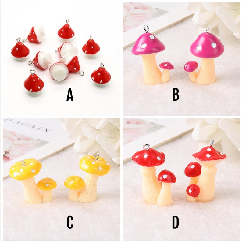 May include: A collection of mushroom charms labeled A, B, C, and D. Group A features small red and white mushroom charms. Group B shows pink and white mushroom charms. Group C displays yellow and white mushroom charms. Group D shows red and white mushroom charms.