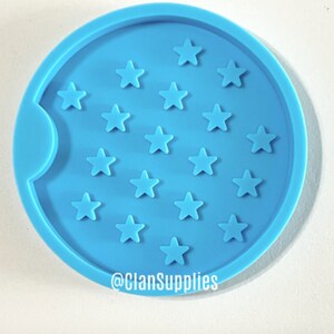 May include: A light blue silicone coaster mold with a cutout for a cup and a design of 18 stars. The mold is for making resin coasters. The text "@ClanSupplies" is at the bottom of the mold.