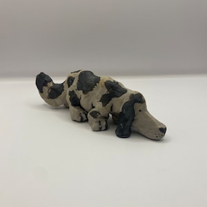 Cute ceramic sculpture of a dog