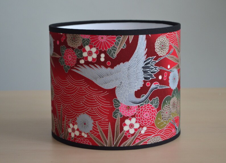 Round lampshade in red, fuchsia pink, silver and green Japanese fabric with a crane bird and flower motif; suitable for table lamps, floor lamps, and ceiling lights. image 1
