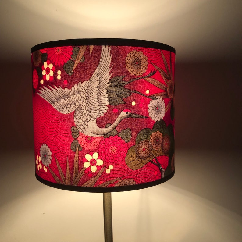 Round lampshade in red, fuchsia pink, silver and green Japanese fabric with a crane bird and flower motif; suitable for table lamps, floor lamps, and ceiling lights. image 2