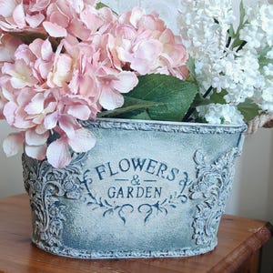 May include: A distressed wooden sign, reading "Welcome to our home" in white. The sign has a rustic finish, ideal for adding a welcoming touch to any home's entrance.