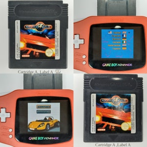 May include: A black Game Boy Advance cartridge with a red and black Game Boy Advance console. The cartridge has a label that says "Roadsters" and "Nintendo Game Boy". The console is displaying the game's title screen.